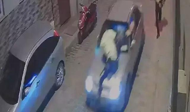 Kendisini durdurmaya çalışan polisi, aracının kaputunda götürdü