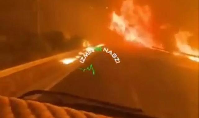 Alevlerin arasından aracıyla geçti